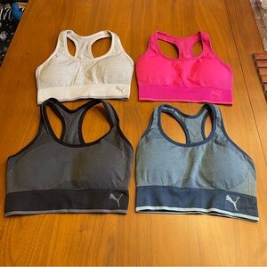 Lot of 4 Puma sports bras racer back 
Black, gray, pink and blue